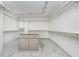 Spacious walk-in closet with shelves and a center island for organized storage at 2305 Van Ness Pl, Indianapolis, IN 46240