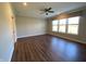 Bright living room with hardwood floors, ceiling fan, neutral paint and large windows for natural light at 2755 Ruffian Dr, Westfield, IN 46074