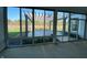 Enclosed patio with a view of the pergola, backyard, and pond at 2755 Ruffian Dr, Westfield, IN 46074