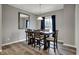 Dining area featuring a modern table set, a window with curtains and a wall mirror at 3123 Bolton Square Blvd, Indianapolis, IN 46222