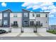 Townhome exterior showcasing modern architecture, private balconies, and attached garages under a blue sky at 3123 Bolton Square Blvd, Indianapolis, IN 46222