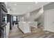 Open-concept kitchen with white cabinets, stainless steel appliances, and a center island, perfect for modern living at 3123 Bolton Square Blvd, Indianapolis, IN 46222
