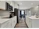Modern kitchen design featuring white countertops, white cabinets, stainless steel appliances, and a kitchen island at 3123 Bolton Square Blvd, Indianapolis, IN 46222