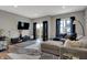 Cozy living area with a comfortable sofa, stylish furnishings, and a sliding door leading to the outside balcony at 3123 Bolton Square Blvd, Indianapolis, IN 46222