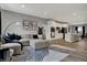 Bright living area with open access to the modern kitchen featuring stainless steel appliances and a kitchen island at 3123 Bolton Square Blvd, Indianapolis, IN 46222