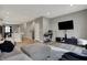Open living space featuring stylish decor, a television, and a view of the kitchen area at 3123 Bolton Square Blvd, Indianapolis, IN 46222