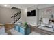 Upstairs view of a cozy living room with a comfortable seating area, and a staircase at 3123 Bolton Square Blvd, Indianapolis, IN 46222