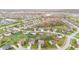 Aerial view of a peaceful suburban neighborhood with lush green lawns, mature trees, and curved streets at 3130 Shadow Lake Dr, Indianapolis, IN 46217