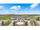 The Clubhouse, with its green roof and white facade, overlooks a golf course and landscaping at 3130 Shadow Lake Dr, Indianapolis, IN 46217