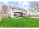 Spacious backyard with lush green grass, fenced perimeter, and outdoor seating area at 3130 Shadow Lake Dr, Indianapolis, IN 46217