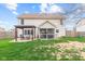 Home's backyard featuring a pergola and screen porch at 3130 Shadow Lake Dr, Indianapolis, IN 46217