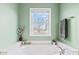 Window view of a soaking tub, complemented by neutral decor and ample sunlight at 3130 Shadow Lake Dr, Indianapolis, IN 46217