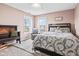 A charming bedroom features a cozy bed, a comfortable chair by the window, and soft natural light at 3130 Shadow Lake Dr, Indianapolis, IN 46217
