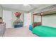 A playfully decorated bedroom features a custom bed, carpet, and well-organized toy storage solutions at 3130 Shadow Lake Dr, Indianapolis, IN 46217