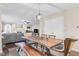Open floor plan showcasing a dining room with a rustic wood table and connecting living area at 3130 Shadow Lake Dr, Indianapolis, IN 46217