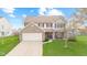 Charming two-story home with a brick facade, two-car garage, and well-manicured lawn at 3130 Shadow Lake Dr, Indianapolis, IN 46217