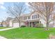 Attractive two-story house featuring brick and siding, an attached garage, and a green lawn at 3130 Shadow Lake Dr, Indianapolis, IN 46217