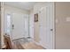 Clean, bright foyer featuring tile floors, a white door, and neutral-colored walls at 3130 Shadow Lake Dr, Indianapolis, IN 46217