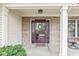 Inviting front entryway featuring a decorative wreath, sidelights, and a welcome mat at 3130 Shadow Lake Dr, Indianapolis, IN 46217