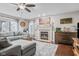 Inviting living room with a fireplace, wooden floors, comfortable seating, and a decorative wooden American flag at 3130 Shadow Lake Dr, Indianapolis, IN 46217