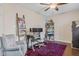 Home office featuring a gray chair at a rustic wooden desk with open shelving and a decorative ladder with throws at 3130 Shadow Lake Dr, Indianapolis, IN 46217