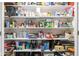Organized pantry shelving filled with various food items and storage containers at 3130 Shadow Lake Dr, Indianapolis, IN 46217