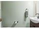 Simple powder room featuring a vanity with a sink and a wall-mounted towel ring at 3130 Shadow Lake Dr, Indianapolis, IN 46217