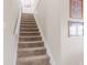 Carpeted staircase with white railing, leading to the upper level of the home at 3130 Shadow Lake Dr, Indianapolis, IN 46217