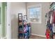 Organized walk-in closet with a window, offering natural light and clothing racks at 3130 Shadow Lake Dr, Indianapolis, IN 46217