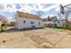 Wide angle view of home's backyard with concrete pad and neighboring houses at 334 N 15Th Ave, Beech Grove, IN 46107