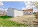 Garage in backyard featuring white siding and new ground cover at 334 N 15Th Ave, Beech Grove, IN 46107