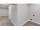 Basement area with new vinyl floors and utility hookups, seamlessly connecting to the rest of the home at 334 N 15Th Ave, Beech Grove, IN 46107