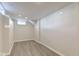 Bright finished basement space with neutral walls and floors, perfect for a Gathering room or play area at 334 N 15Th Ave, Beech Grove, IN 46107
