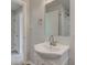 Well-lit bathroom features a white vanity with a large mirror and bright white walls at 334 N 15Th Ave, Beech Grove, IN 46107