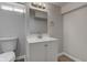 Renovated bathroom with a modern vanity, neutral color scheme, and ample lighting for a fresh, clean feel at 334 N 15Th Ave, Beech Grove, IN 46107
