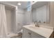 Updated bathroom featuring modern fixtures, a shower with white tile, and a spacious layout at 334 N 15Th Ave, Beech Grove, IN 46107