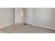 Bedroom with neutral walls and carpet and two open doorways at 334 N 15Th Ave, Beech Grove, IN 46107