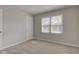 Neutral bedroom with carpet, a door and a window at 334 N 15Th Ave, Beech Grove, IN 46107