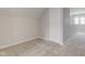 Cozy bedroom space with neutral carpet, paint, and a closet for storage solutions at 334 N 15Th Ave, Beech Grove, IN 46107