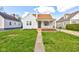 Charming single-story home with a tidy front yard, walkway, and inviting porch at 334 N 15Th Ave, Beech Grove, IN 46107