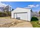 Exterior view of the garage showing a basketball hoop and white siding at 334 N 15Th Ave, Beech Grove, IN 46107