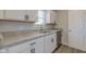 The updated kitchen has granite countertops and stainless steel appliances, including a dishwasher at 334 N 15Th Ave, Beech Grove, IN 46107