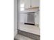 Modern kitchen featuring white cabinets, granite countertops, stainless steel dishwasher, and durable floors at 334 N 15Th Ave, Beech Grove, IN 46107
