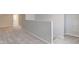 A landing featuring neutral carpeting and walls, leading to various rooms and storage space at 334 N 15Th Ave, Beech Grove, IN 46107