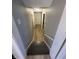 Basement staircase leading to finished basement with neutral walls and new floors at 3413 Ivory Way, Indianapolis, IN 46227