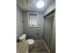 Bathroom featuring toilet, shower and window at 3413 Ivory Way, Indianapolis, IN 46227