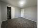 A gray bedroom with a closet and white doors, freshly painted and clean at 3413 Ivory Way, Indianapolis, IN 46227