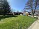 Inviting home with lush green lawn and mature trees creating a picturesque setting at 3413 Ivory Way, Indianapolis, IN 46227
