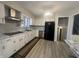 Bright kitchen featuring new appliances, updated countertops, and modern lighting at 3413 Ivory Way, Indianapolis, IN 46227