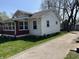 Exterior view of the property showing a concrete driveway and a section with brick accents at 3751 Creston Dr, Indianapolis, IN 46222